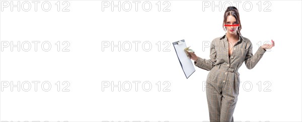 Woman interviewer stands in the studio on a white background with a tablet in her hand. Job interview concept. Recruiting and personnel selection.