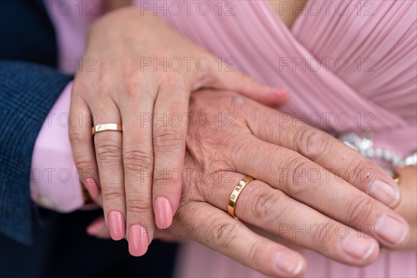 Details of the hands of the bride and groom with rings in a beautiful wedding