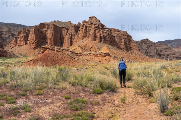 Climber in a canyon with a dry stream bed