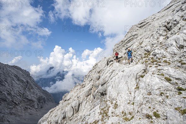 Mountaineer on a steep rocky path