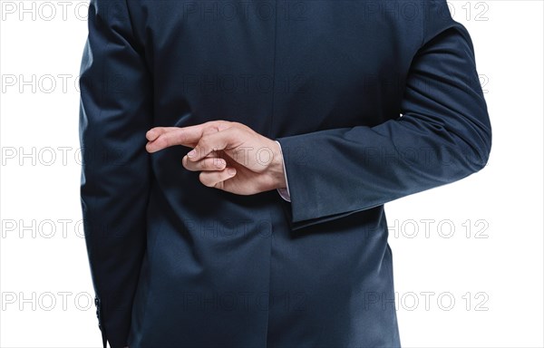 Image of a man's hands with crossed fingers on a white background. Back view. Business concept.