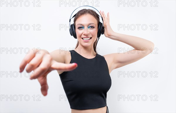 Portrait of a woman in professional headphones. White background. Dj concept.