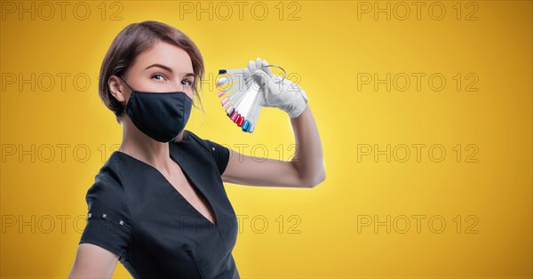 Portrait of an elegant beautiful girl with a set of nail palette in hand. The concept of beauty salons