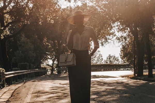 Portrait of a charming girl walking in a park in Florence. The concept of tourism