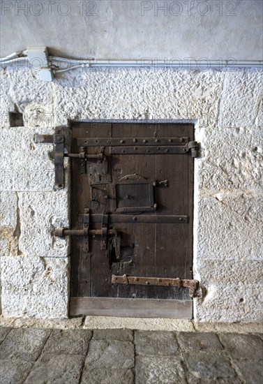 Historic 16th century door with many locks