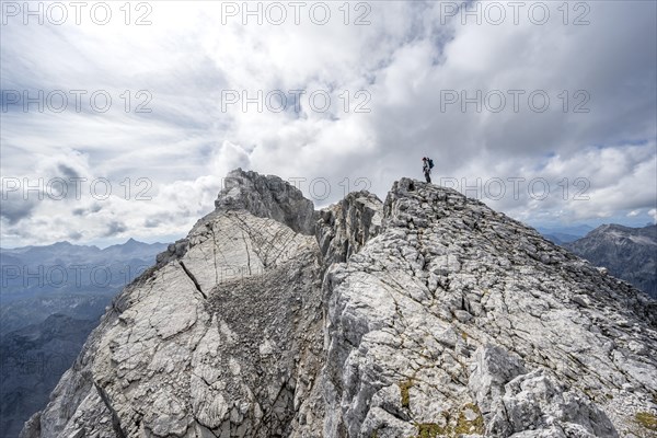 Mountaineer on a narrow rocky ridge