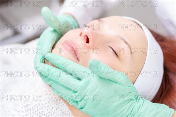 Beautiful girl gets face peeling. Skin health concept. Beauty salons.