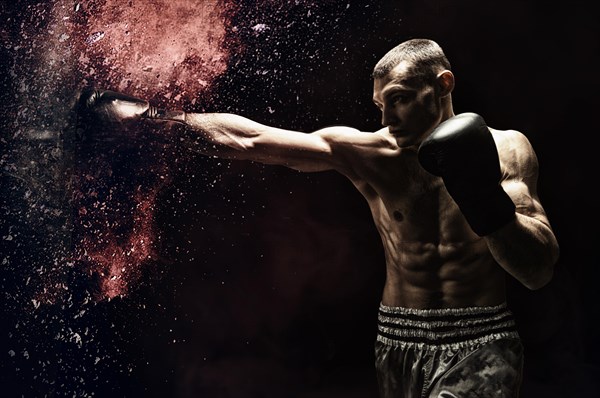 Professional boxer hits the bag. The concept of sport