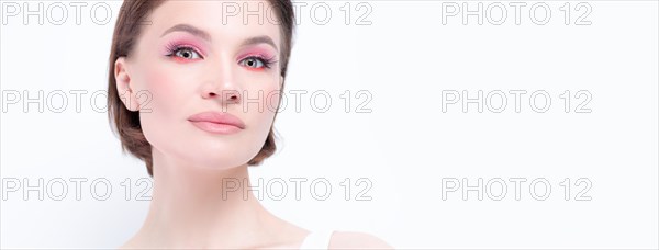 Portrait of a beautiful girl with provocative makeup. White background. Beauty concept. High quality