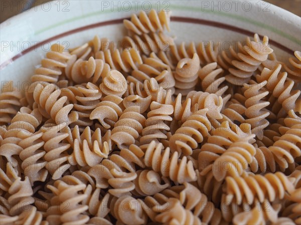 Fusilli Italian pasta background