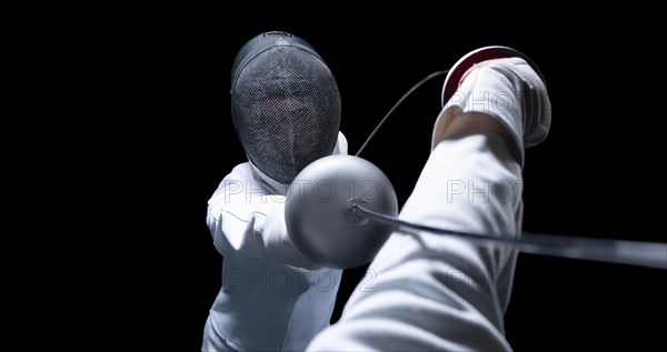 Two fencers are fighting in a tournament. The concept of fencing.