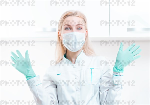 Portrait of a blonde girl in a mask. Coronavirus epidemic concept. Pandemic.