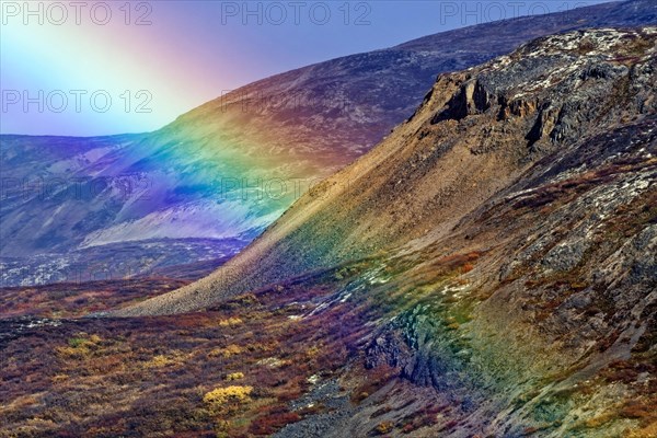 Rainbow over the mountains on the Haines Highway near Haines Junction