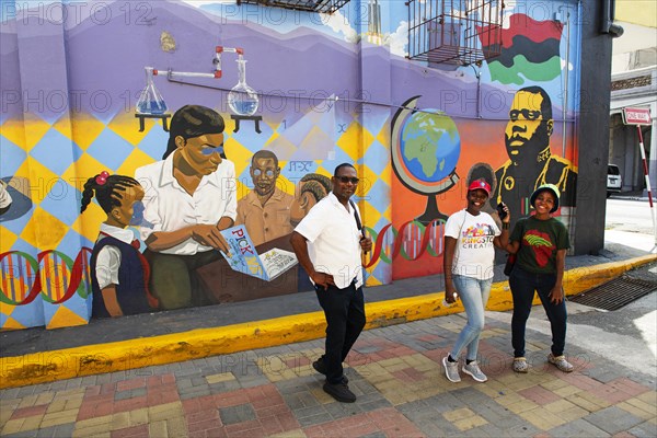 Guides in front of Marcus Garvey