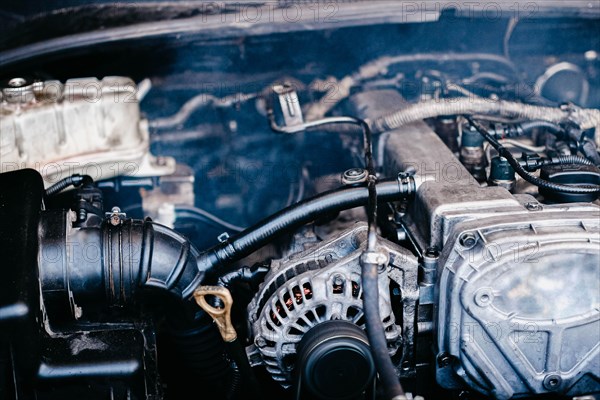 Generator in a car near an internal combustion engine