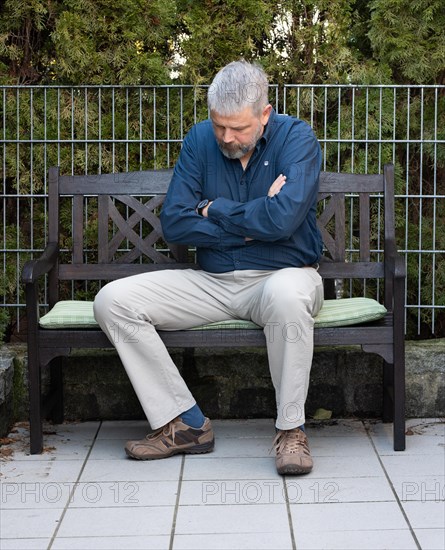 Man with grey hair and a full beard