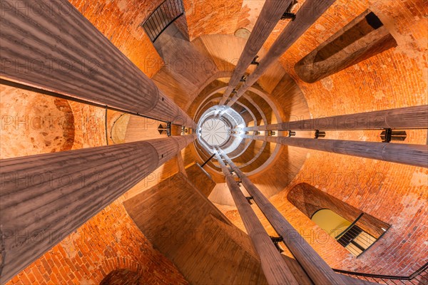 View upwards inside a spiral tower with columns