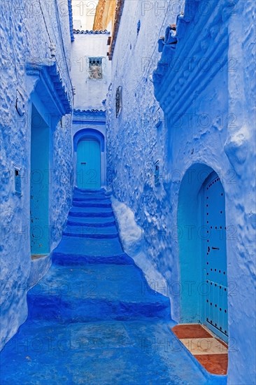 Narrow alleyway with blue walls