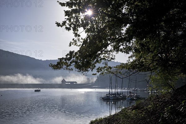 Eder dam with dam wall and pleasure boats on the Edersee