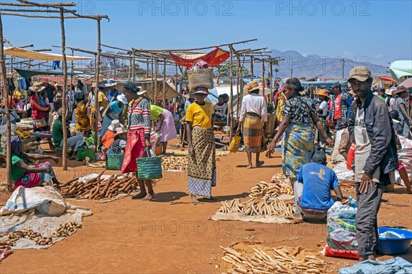 Malagasy vendors selling fruit and vegetables at food market in the city Ambalavao