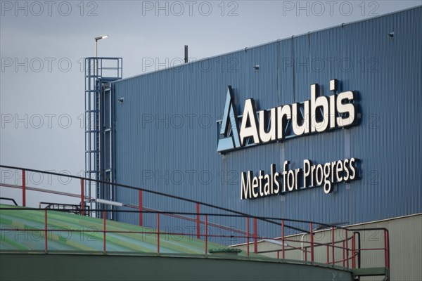 Logo and lettering Aurubis Metal for Progress on a factory building at the Aurubis AG plant