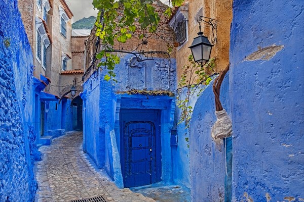 Narrow alleyway with blue walls