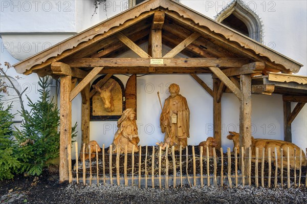 Grippe at the town hall with figures made of Swiss stone pine