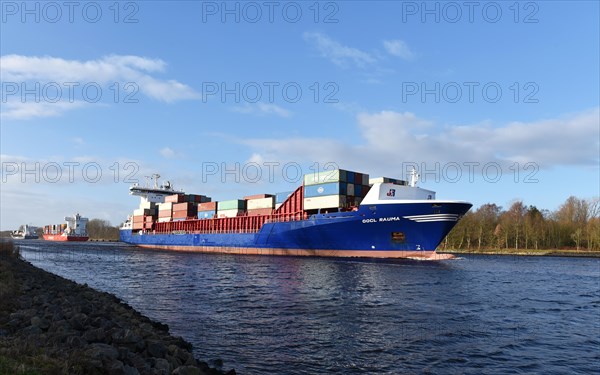 Container ship Oocl Rauma sailing in the Kiel Canal