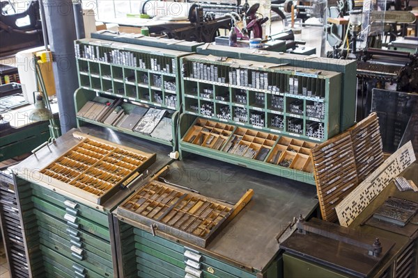 Type case in composing room at printing business