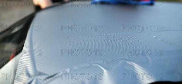 Covering the car body with carbon film