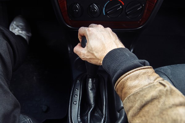 A man is driving a premium car