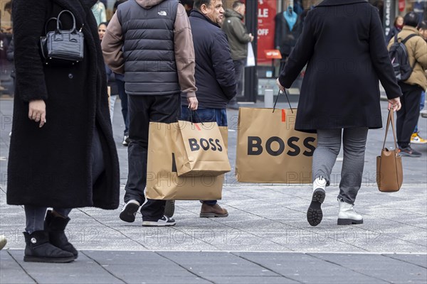 Consumer tourist lugging shopping bags