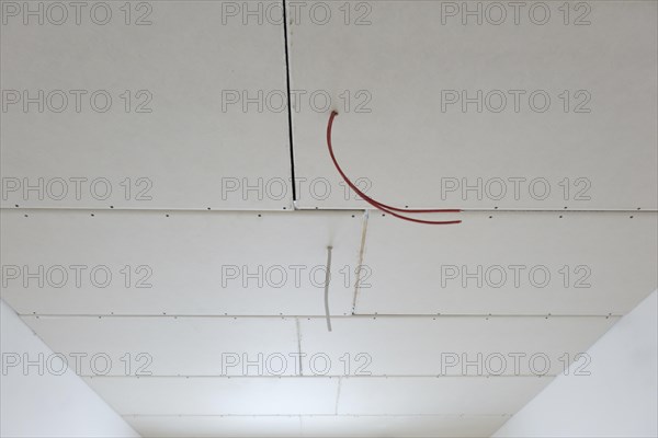 Plasterboard panels under the ceiling