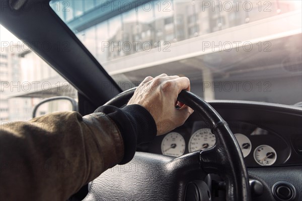 A man is driving a premium car