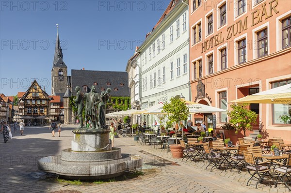 Cafe on the market square with St Benedikti church and town hall