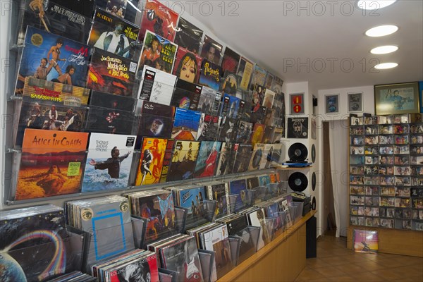 Interior view of a music shop with a wide selection of vinyl records and CDs
