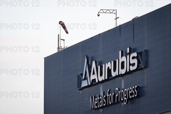 Logo and lettering Aurubis Metal for Progress on a factory building at the Aurubis AG plant