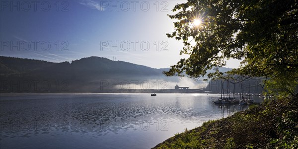 Eder dam with dam wall and pleasure boats on the Edersee