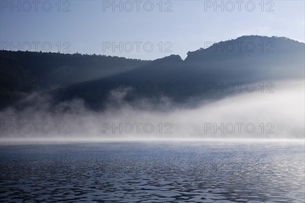 Edertalsperre with fog on the Edersee in the early morning