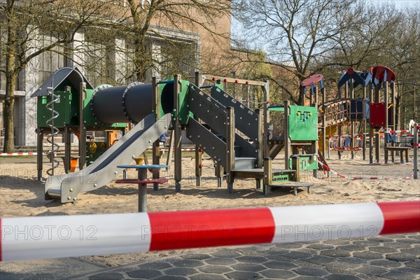 Deserted public children's playground closed and obstructed with tape due to the 2020 COVID-19