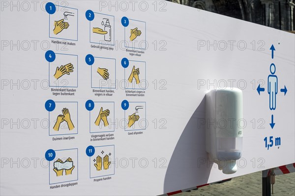 Instructions at hand washing station in shopping street during the 2020 COVID-19