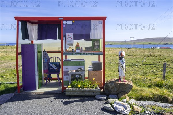 Amusing bus stop shelter furnished and decorated with home comforts near Baltasound