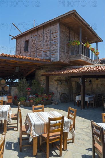 Traditional wooden windmill with terrace and seating