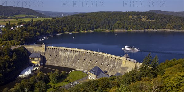 Elevated view of the Eder dam with the dam wall and an excursion boat on the Edersee
