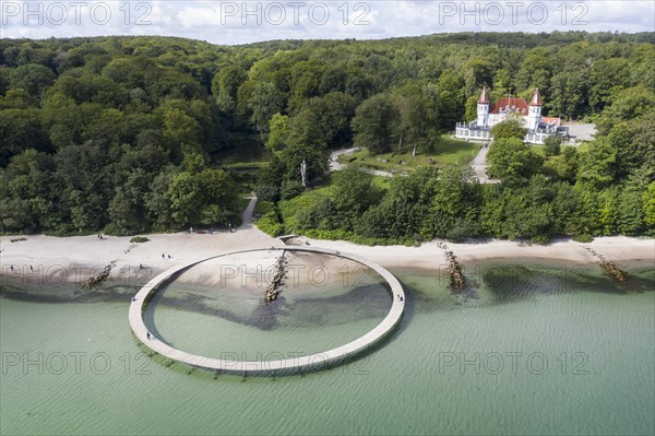 An aerial view shows people walking on the infinite bridge. The bridge is a work of art built by Sculpture by the Sea