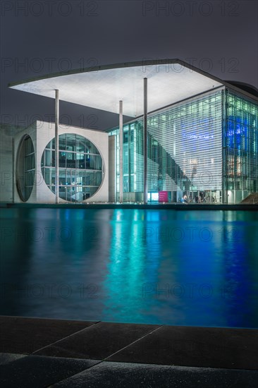 Modern architecture of a government building at night on the waterfront