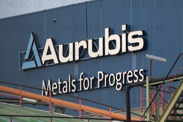 Logo and lettering Aurubis Metal for Progress on a factory building at the Aurubis AG plant