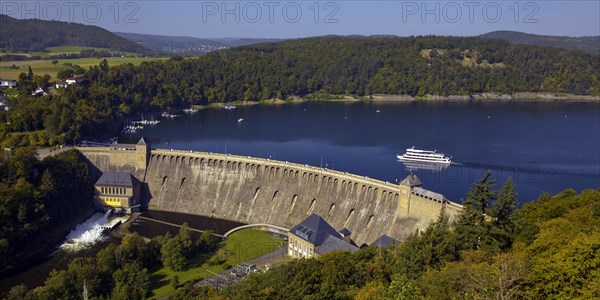 Aerial view of the Eder dam with the dam wall and a ship on the Edersee
