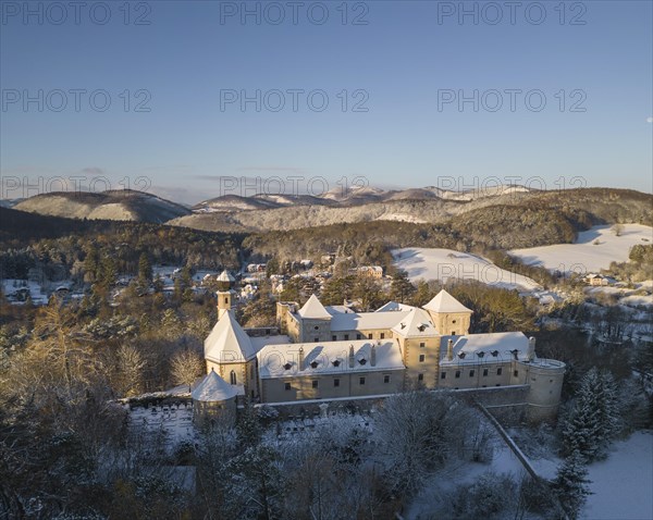 Aerial view of castle and church in winter