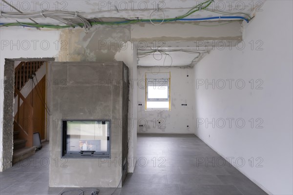 Room with newly laid electrical cables under the ceiling